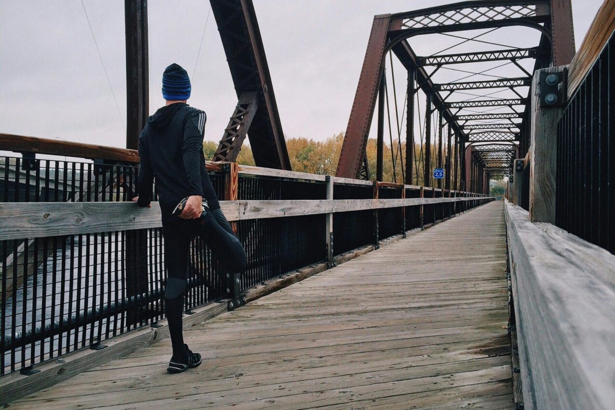 Athlete stretching after a run, emphasizing recovery for athletes over 40